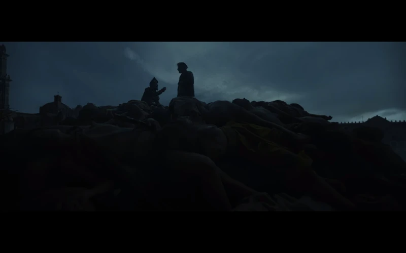 Cortés hides in the darkness.