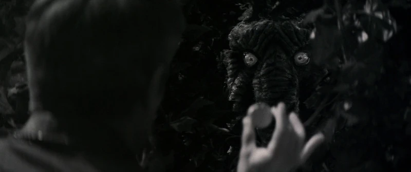 Man-Thing hides himself in a bush. Man-Thing hides himself in a bush.